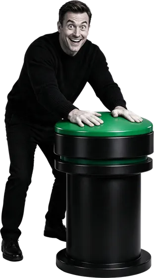 Excited man pressing a giant green button that sets everything running